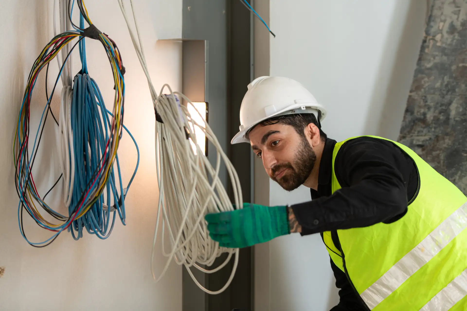 An electrician working with electrical wiring