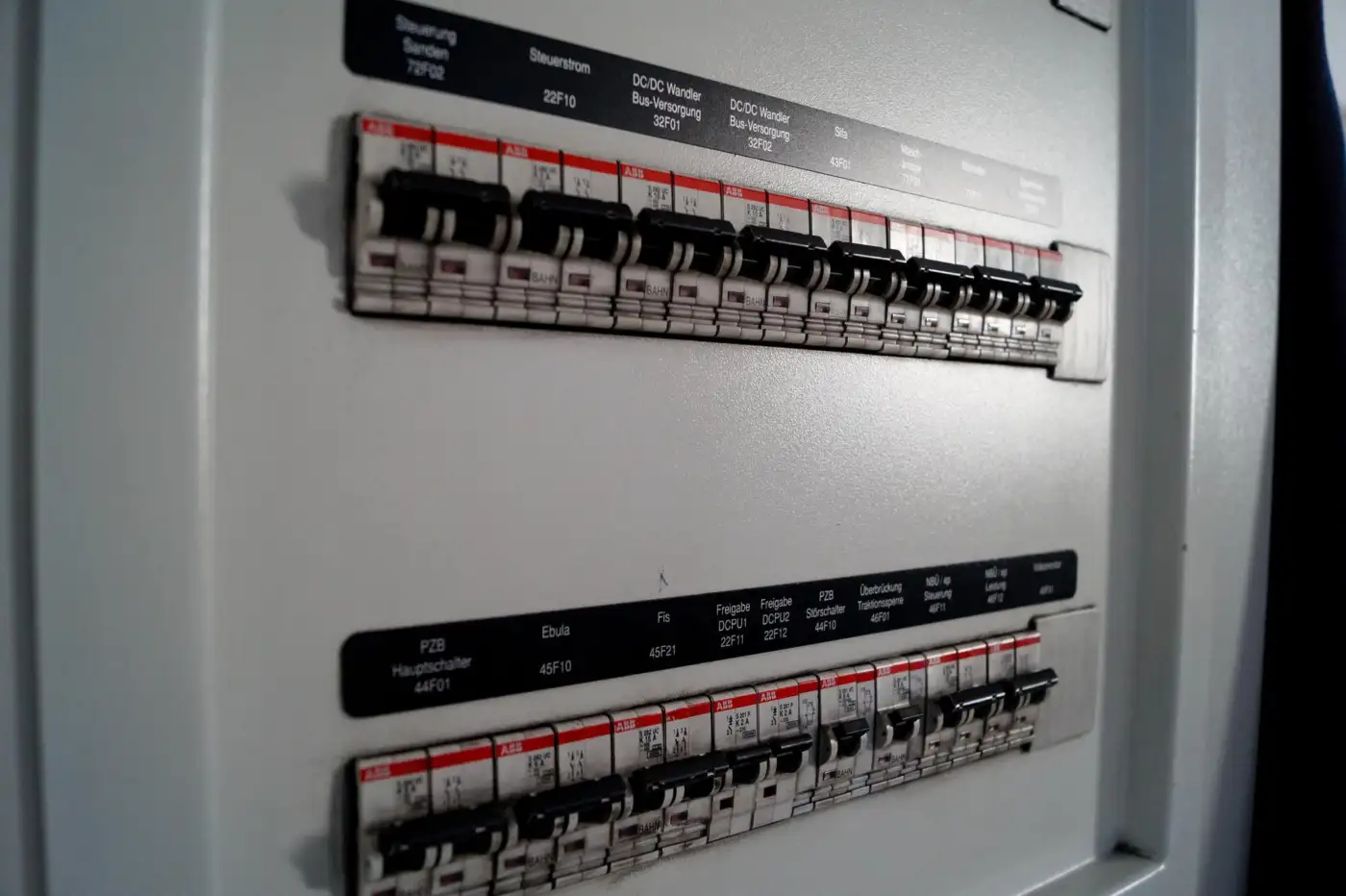 An electrician checking certification and wiring against the BS 7671 standard