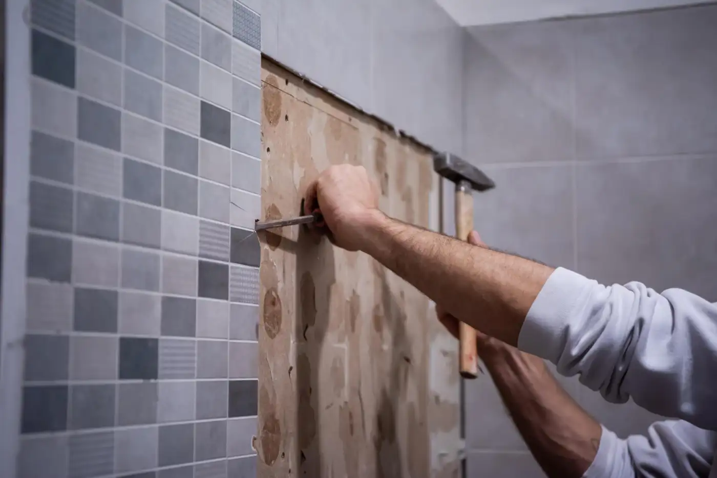 A newly fitted family bathroom with a tiled shower, basin and bath