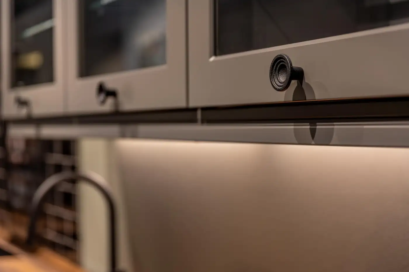 A finished kitchen detail showing a worktop, cabinetry and an integrated hob