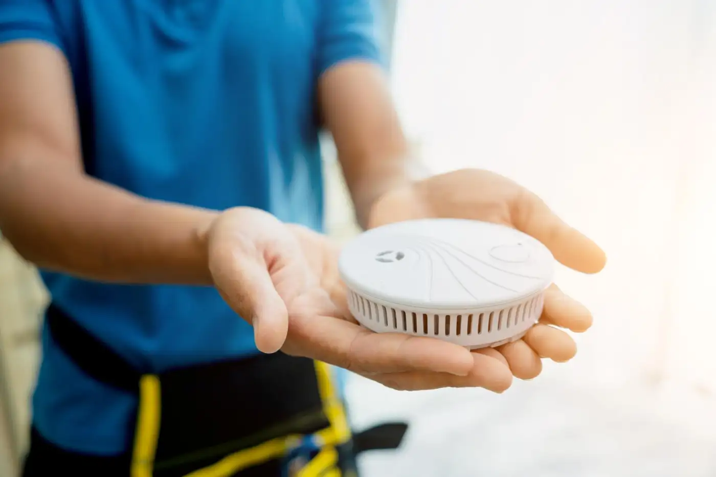 Working smoke alarms fitted to the ceiling of a hallway on a landing