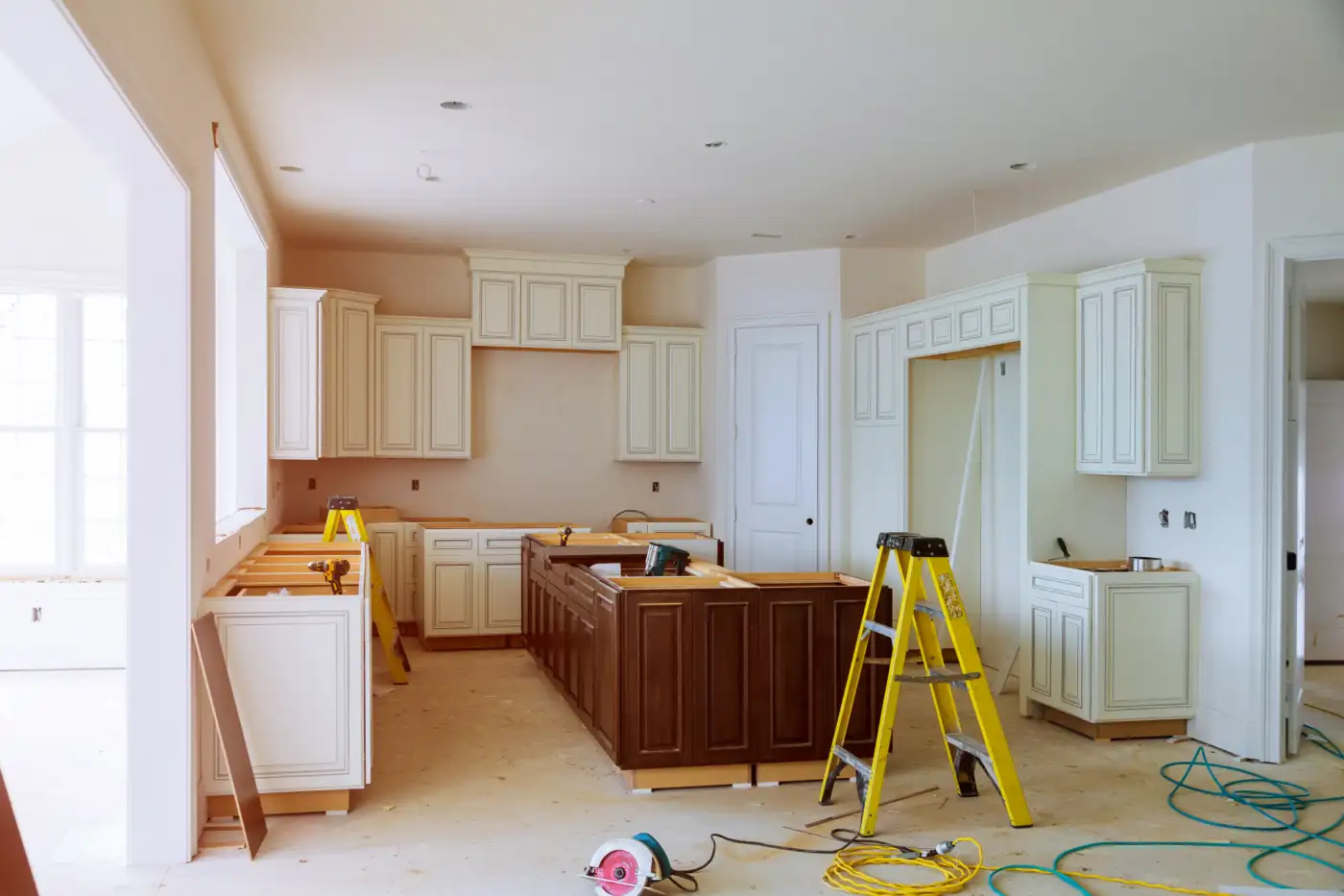Modern kitchen with newly installed cabinet units and integrated appliances